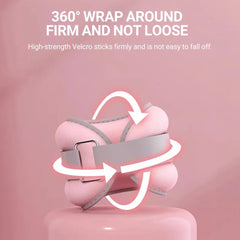 Pink wrist and ankle weights with Velcro strap on a pink background, emphasizing firm attachment.