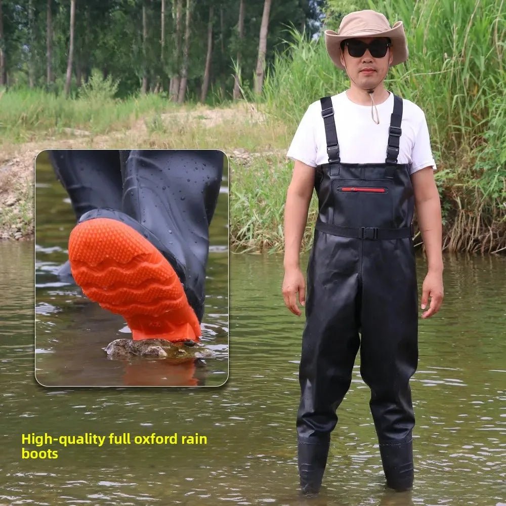 Person wearing black rain boots with orange sole in a natural setting