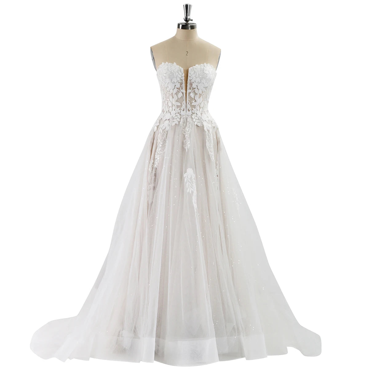 White lace wedding dress on a mannequin against a white background