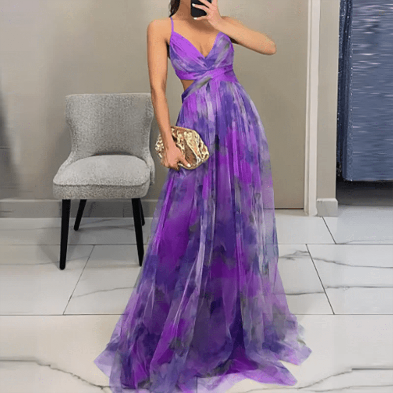 Woman wearing a purple evening gown holding a gold clutch in a room.