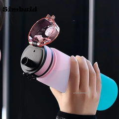 Hand holding a pink and black device with a clear cover, brand 'Simbuid' visible.