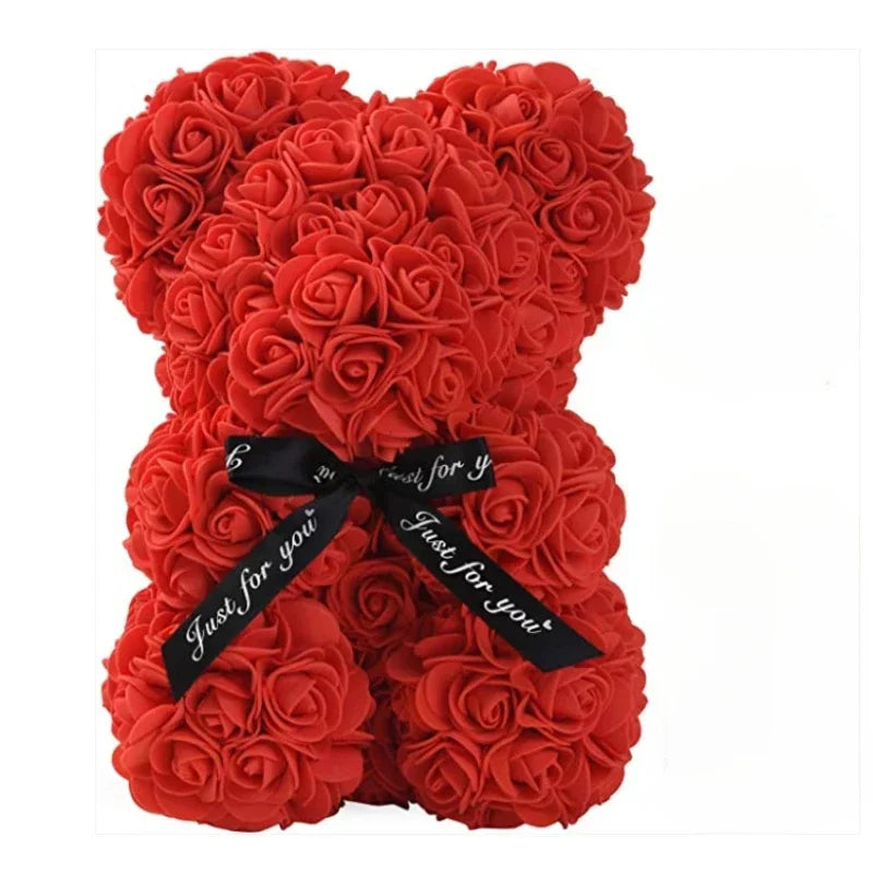 Red rose teddy bear with a black ribbon on a white background