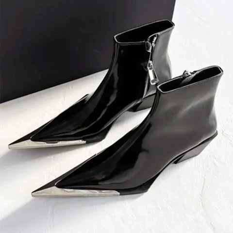 Black pointed-toe ankle boots with silver zippers on a white background