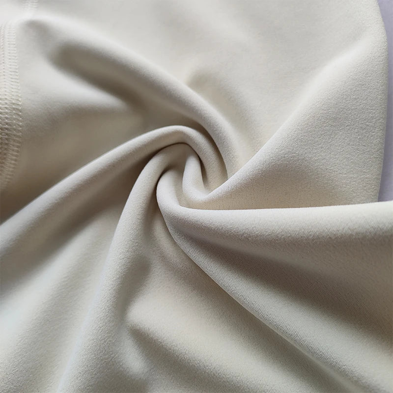 Close-up of beige fabric with a soft texture