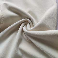 Close-up of beige fabric with a soft texture