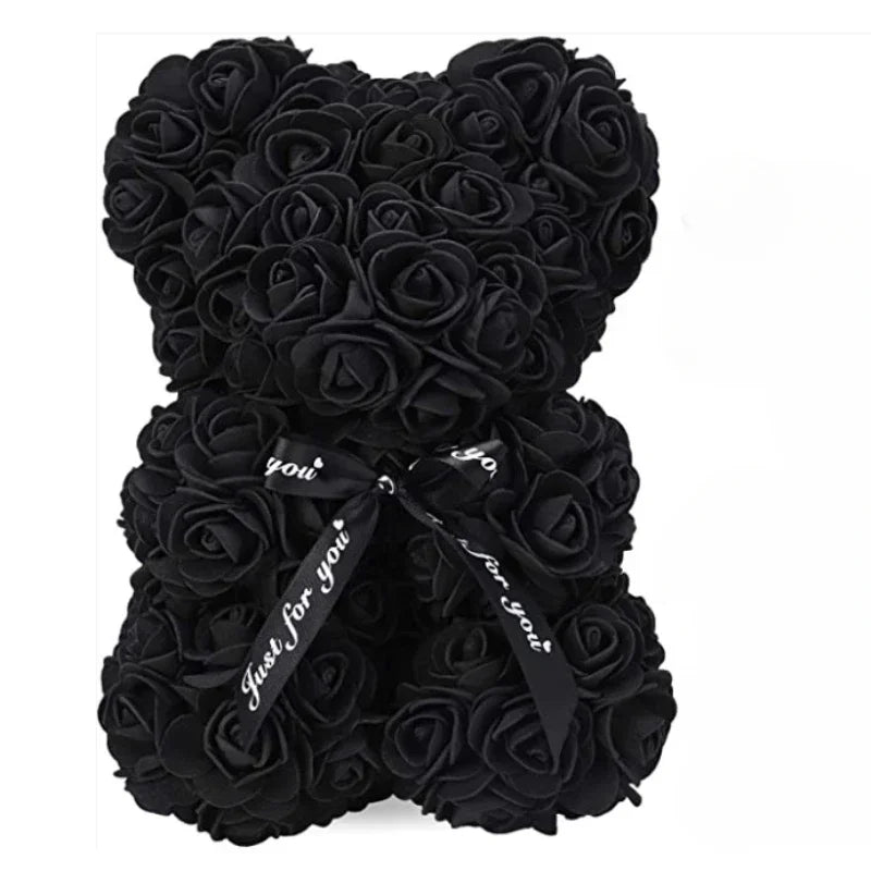 Black rose teddy bear with a black ribbon on a white background