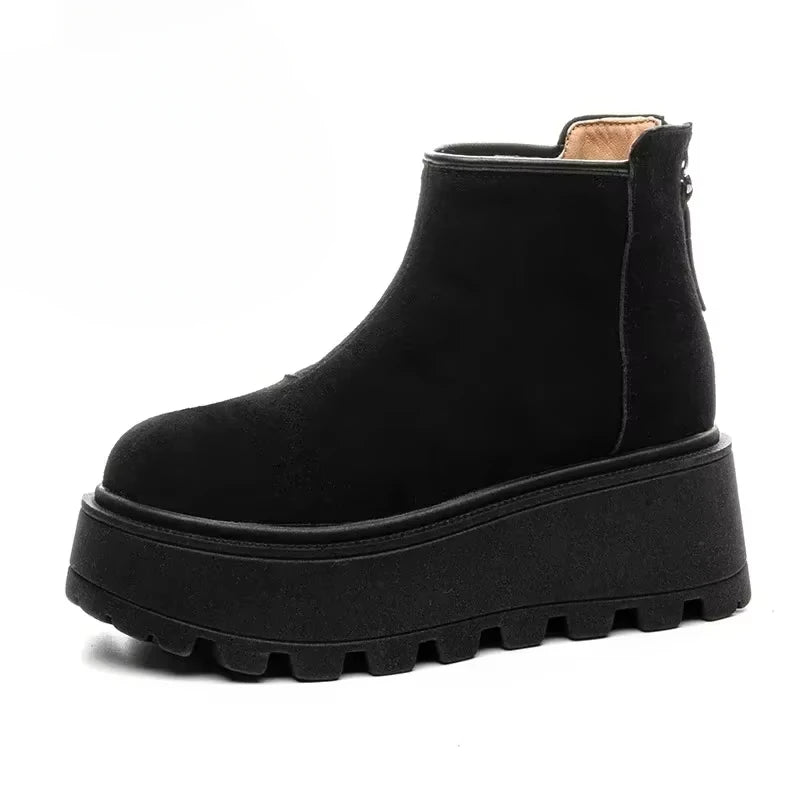 Black platform ankle boot on a white background