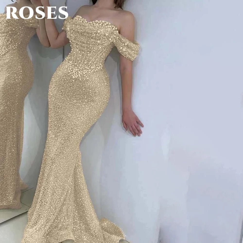 Gold off-shoulder evening gown with 'ROSES' text above.