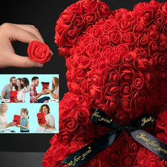 Red rose teddy bear with a hand holding a red rose, surrounded by people holding similar gifts.