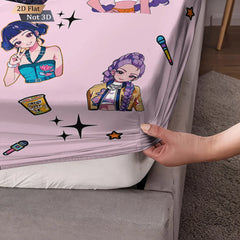 Sheet with cartoon character design being held up to a bed.