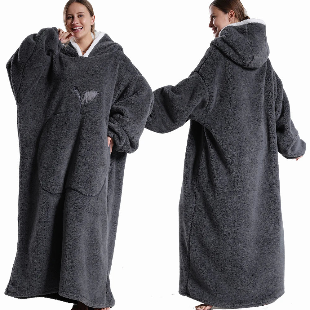 Person wearing a gray hoodie with a blanket attached, shown from front and back views.