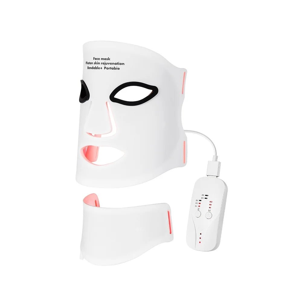 White face mask with black eye holes and red accents, accompanied by a white device on a white background.
