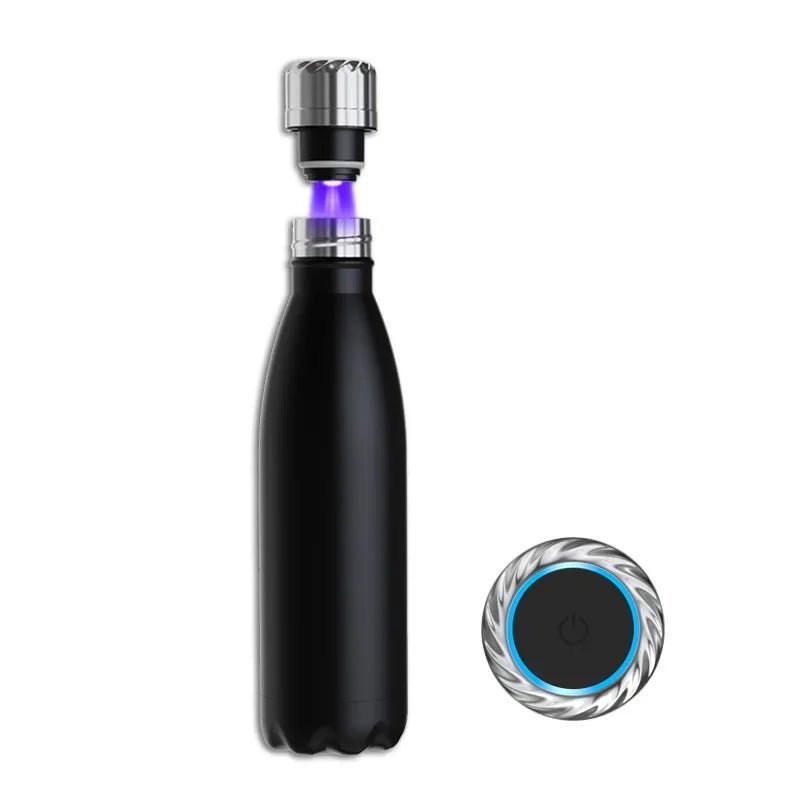 Black water bottle with a silver cap and a small circular device on a white background
