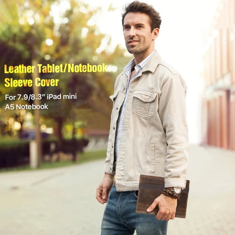 Man holding a leather tablet/notebook sleeve cover outdoors