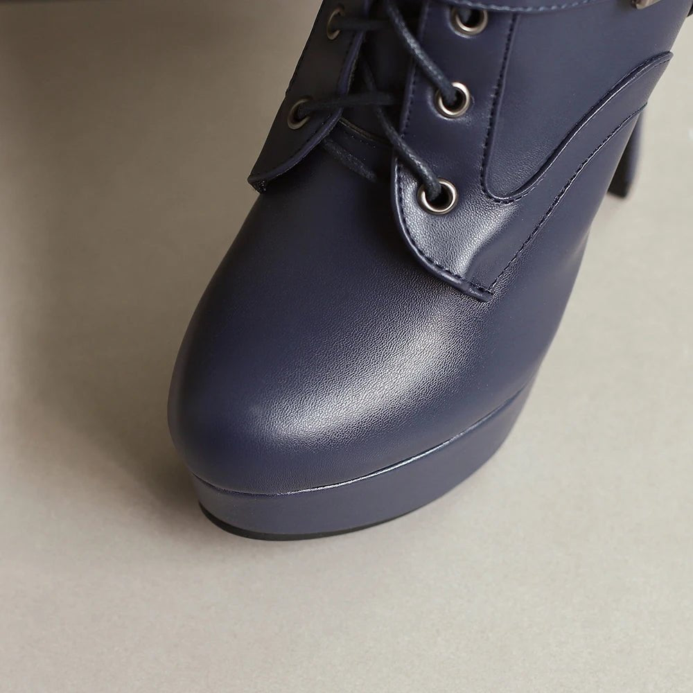 Blue platform shoe on a neutral background