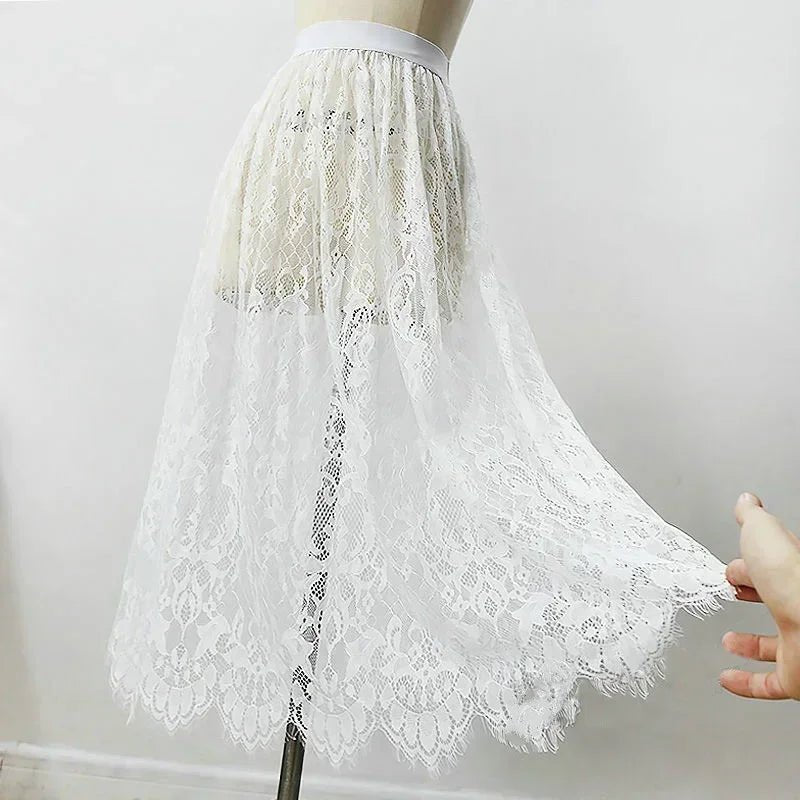 White lace skirt on a mannequin against a plain background