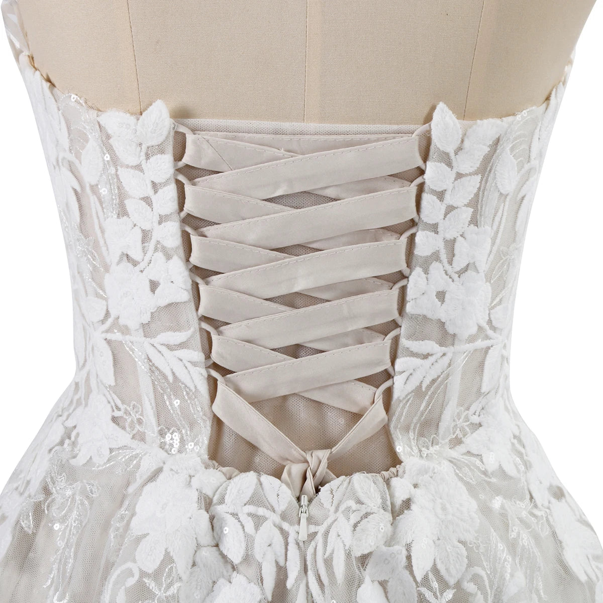 White lace dress on a mannequin with intricate detailing