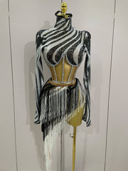 Zebra print top with fringe on a mannequin against a white background