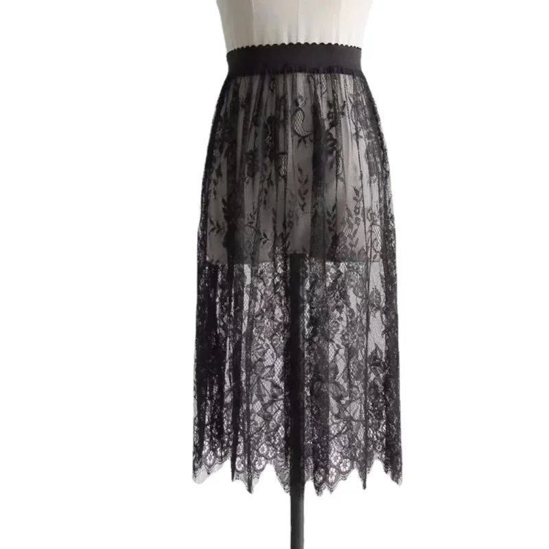 Black lace skirt on a mannequin against a white background