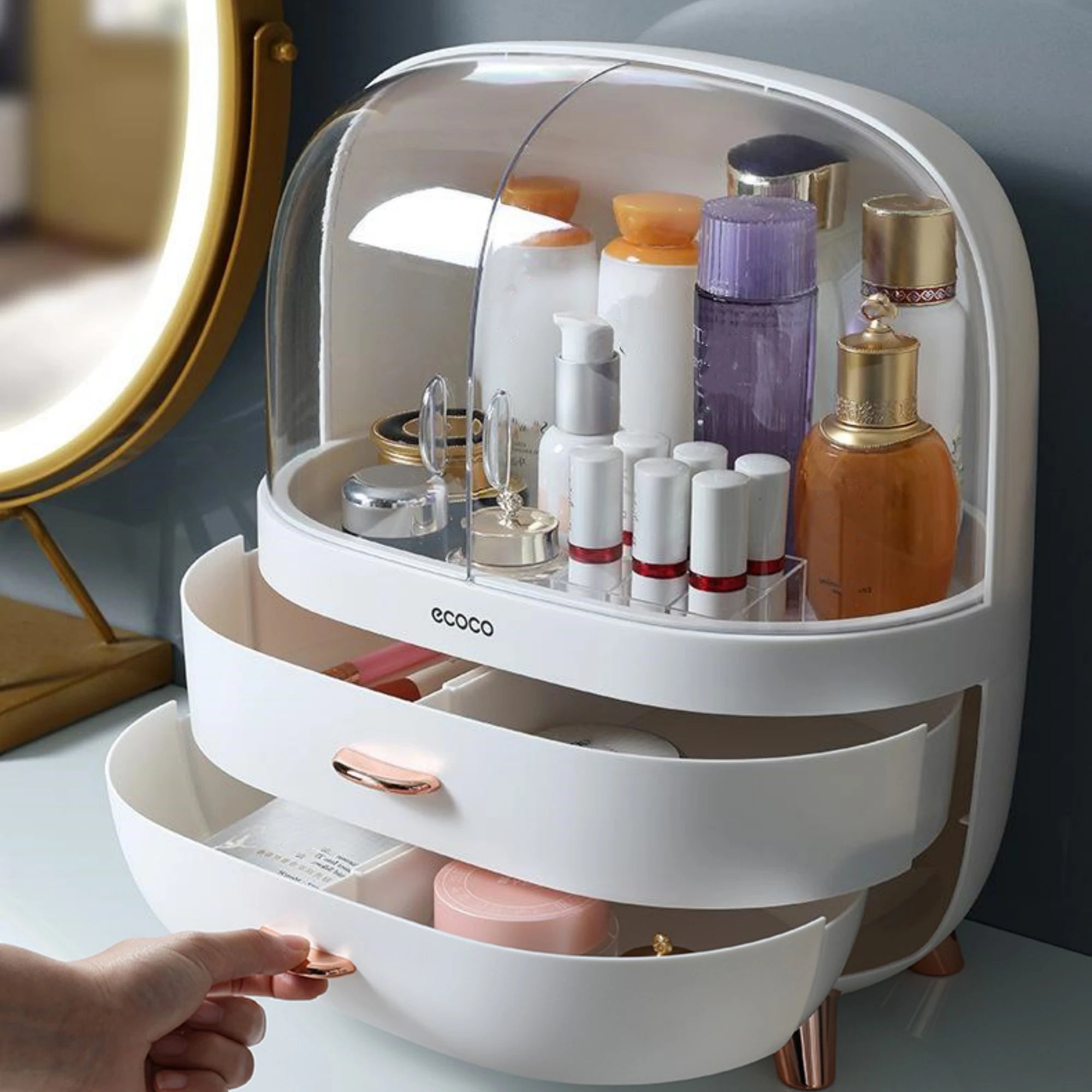 White cosmetic organizer with various products on a light surface.