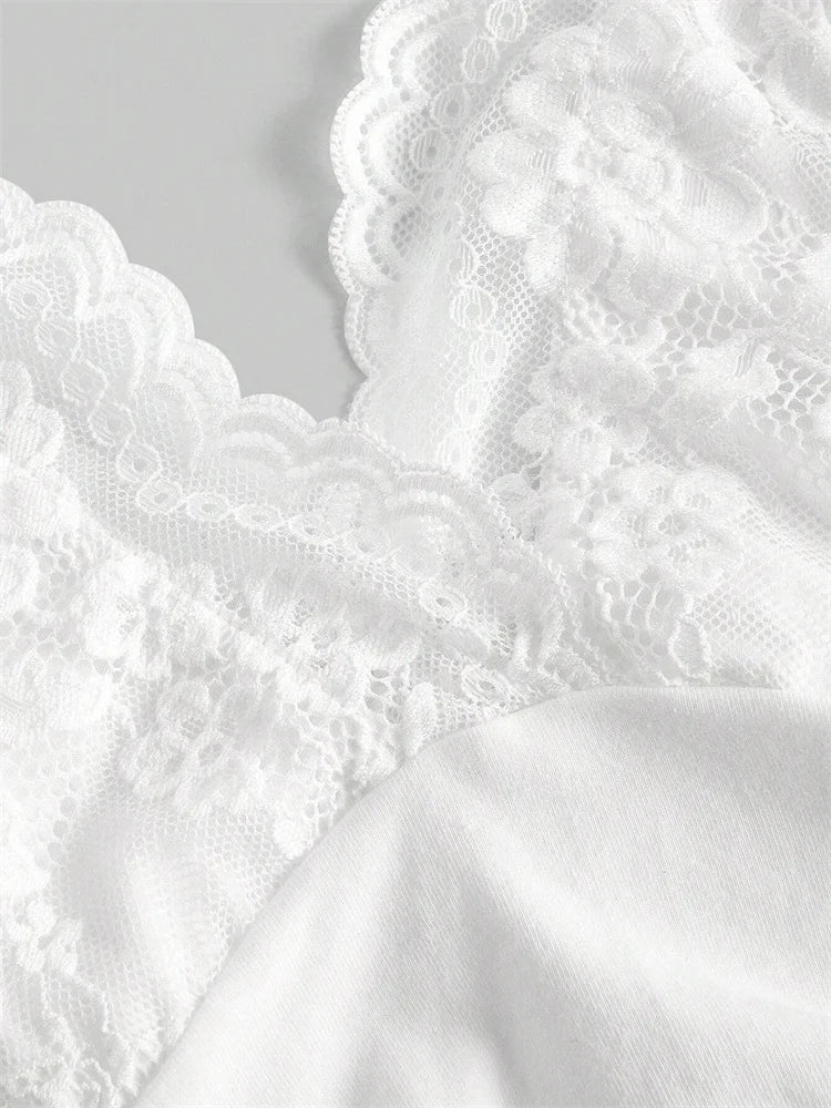 Close-up of white lace fabric on a light gray background