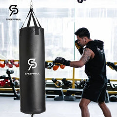Person training with a punching bag in a gym setting, featuring the Saeepabul brand.
