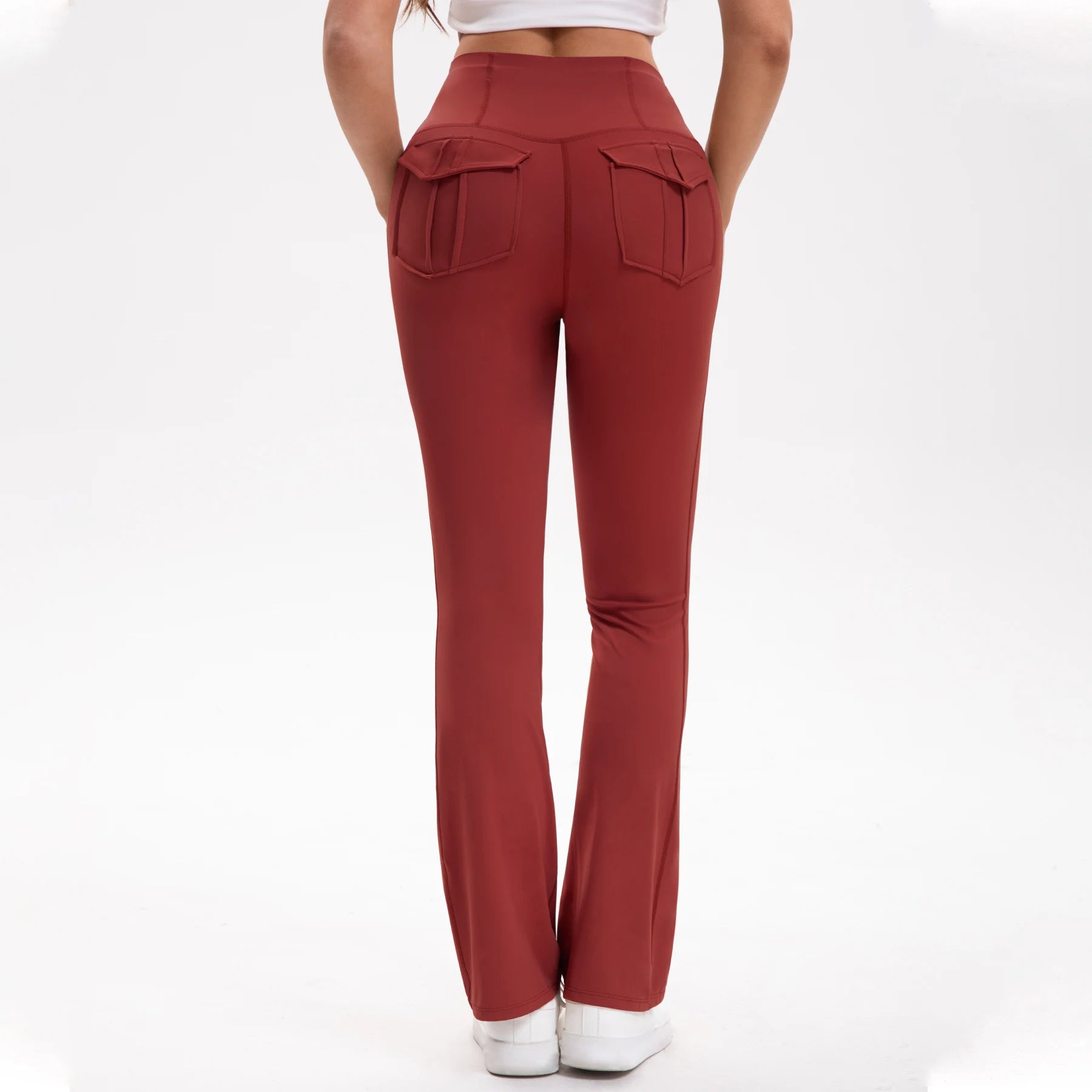 Red pants worn by a person on a white background