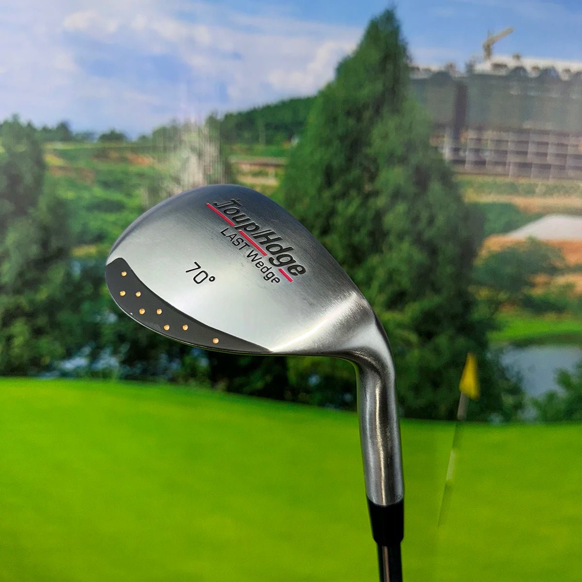 Golf club with 'John Hoge' branding on a golf course background