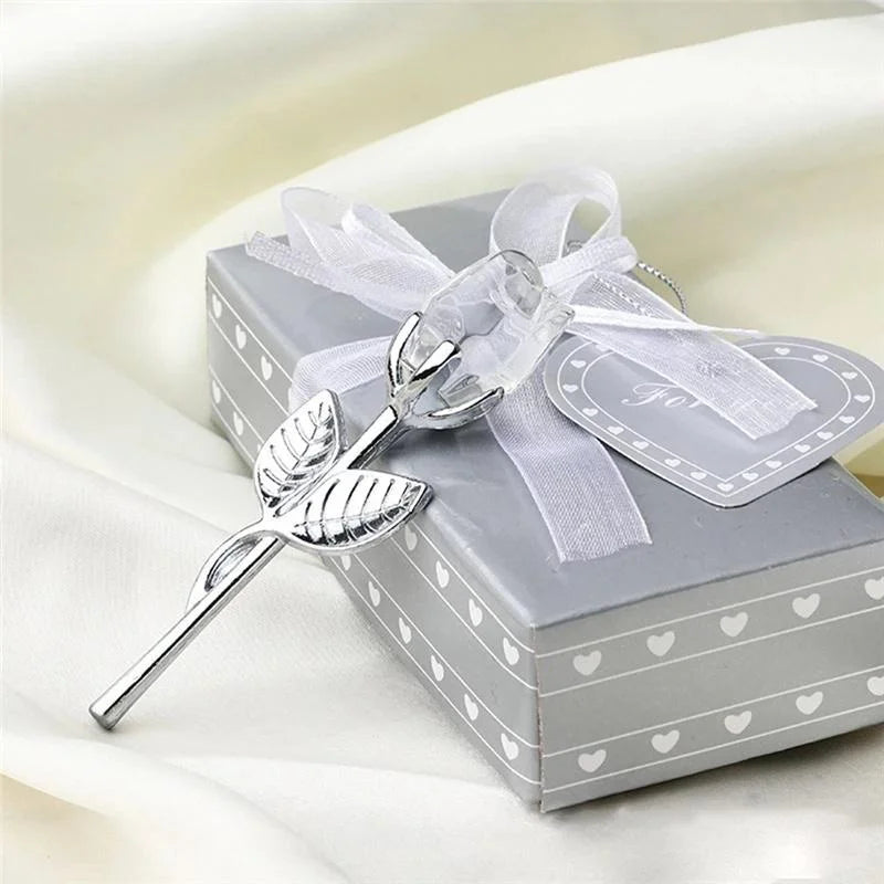 Silver leaf-shaped object on a gray box with white heart patterns