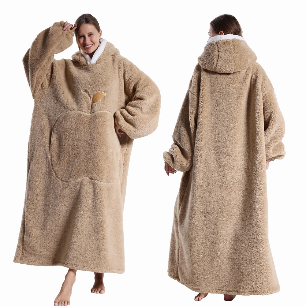 Beige fleece poncho worn by a person on a white background