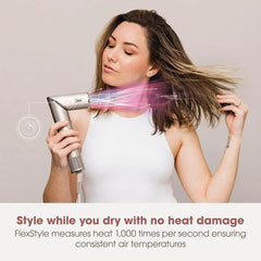 Woman using a hair dryer with a focus on styling without heat damage, set against a plain background.