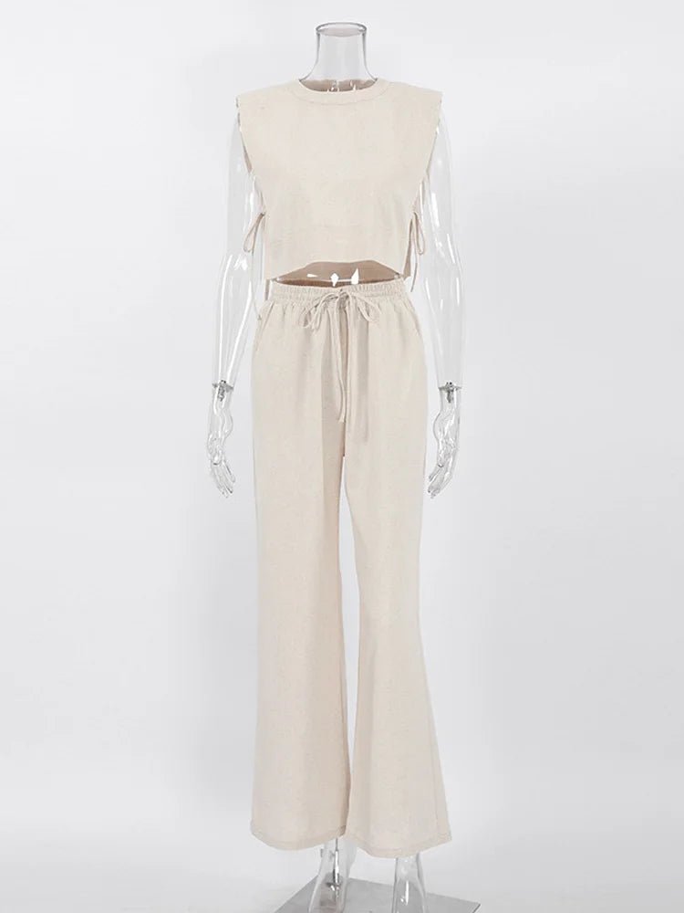 Mannequin wearing a beige sleeveless top and pants set on a white background