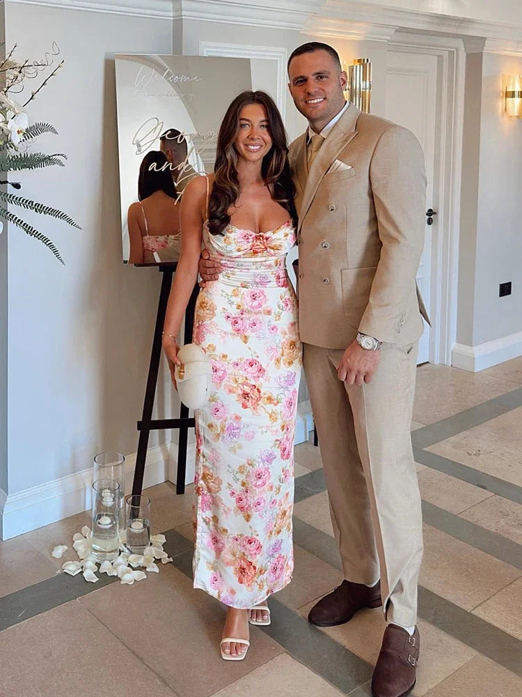 Man and woman posing together in a stylish indoor setting