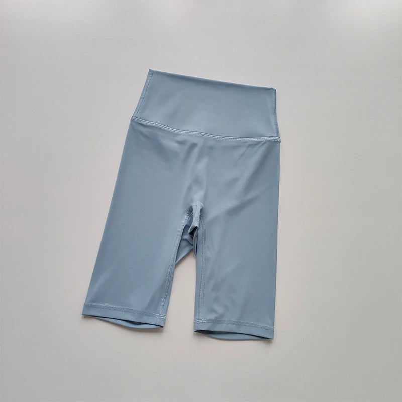 Blue athletic shorts on a gray background