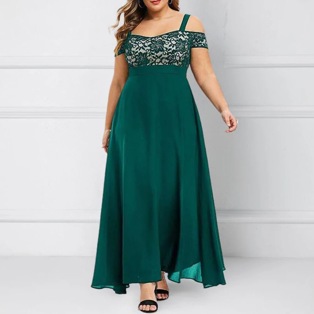 Woman wearing a green evening gown with lace details against a white background