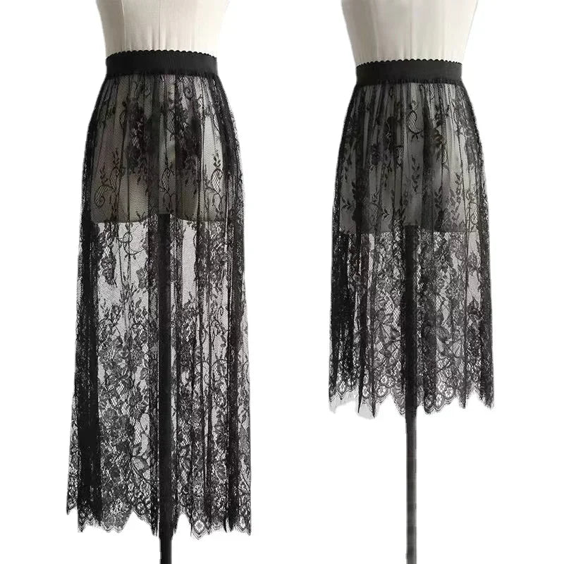 Two black lace skirts on mannequins against a white background